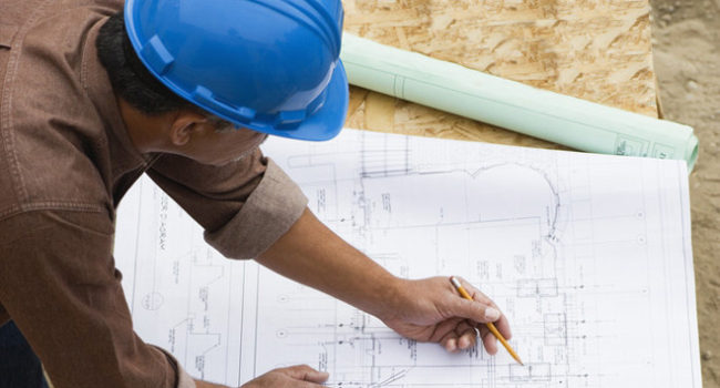 Contractor Working on Building Plans